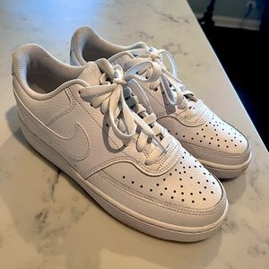Woman’s white Nike AF1